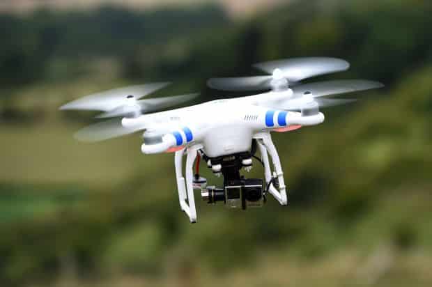 File photo dated 11/08/15 of a drone in flight. A British Airways flight was struck by what is believed to be a drone as it came in to land at Heathrow Airport, police said. PRESS ASSOCIATION Photo. Issue date: Monday April 18, 2016. The pilot of flight BA727 from Geneva in Switzerland reported being hit as the Airbus A320 bound for Terminal Five approached the London hub on Sunday afternoon with 132 passengers and five crew on board. See PA story POLICE Drone. Photo credit should read: Andrew Matthews/PA Wire
