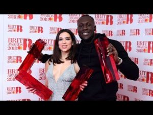 Stormzy takes home two Brit awards and calls out Theresa May | @MalikkkG