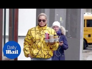 Hello sunshine! Yolanda Hadid shines in yellow in rainy NYC – Daily Mail
