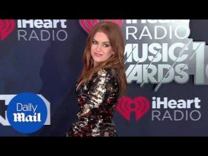 Isla Fisher sparkles in black and gold sequin dress at iHeart – Daily Mail