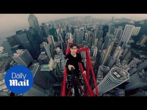 Moment daredevil climber scales HUGE crane in Hong Kong – Daily Mail