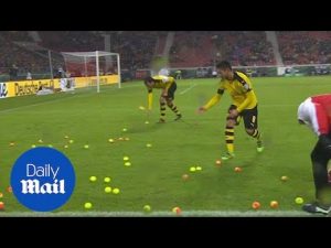 Moment outraged Dortmund fans chuck tennis balls onto pitch – Daily Mail