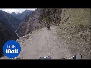 That’s a big drop! Biker ride world’s most dangerous road – Daily Mail