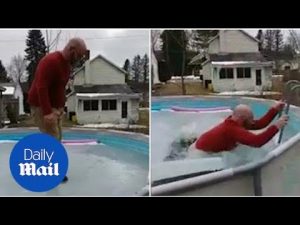 Watch your step! Man walks about frozen pool and falls in – Daily Mail