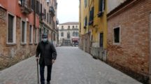 man walking down the road with a mask during corona virus outbreak